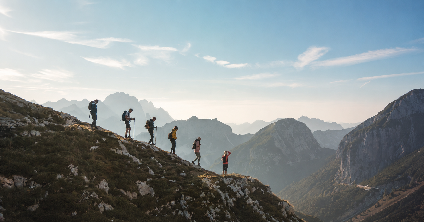 Hikers moving through a mountain landscape